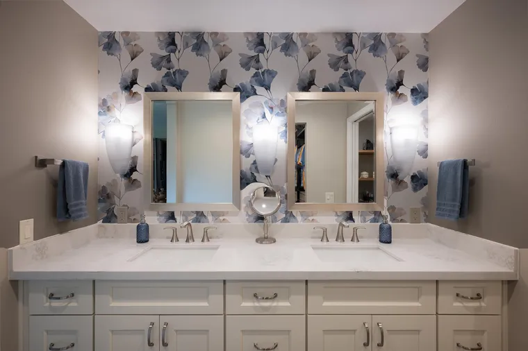 Double vanity with botanical wallpaper and two mirrors