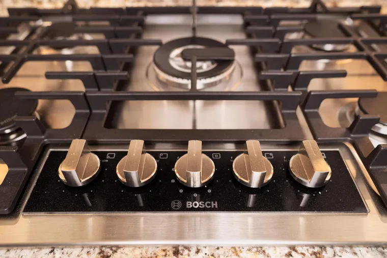 Gas cooktop set into a granite counter