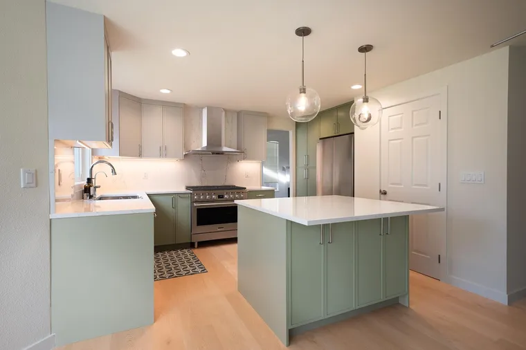 Sage green island under glass pendants