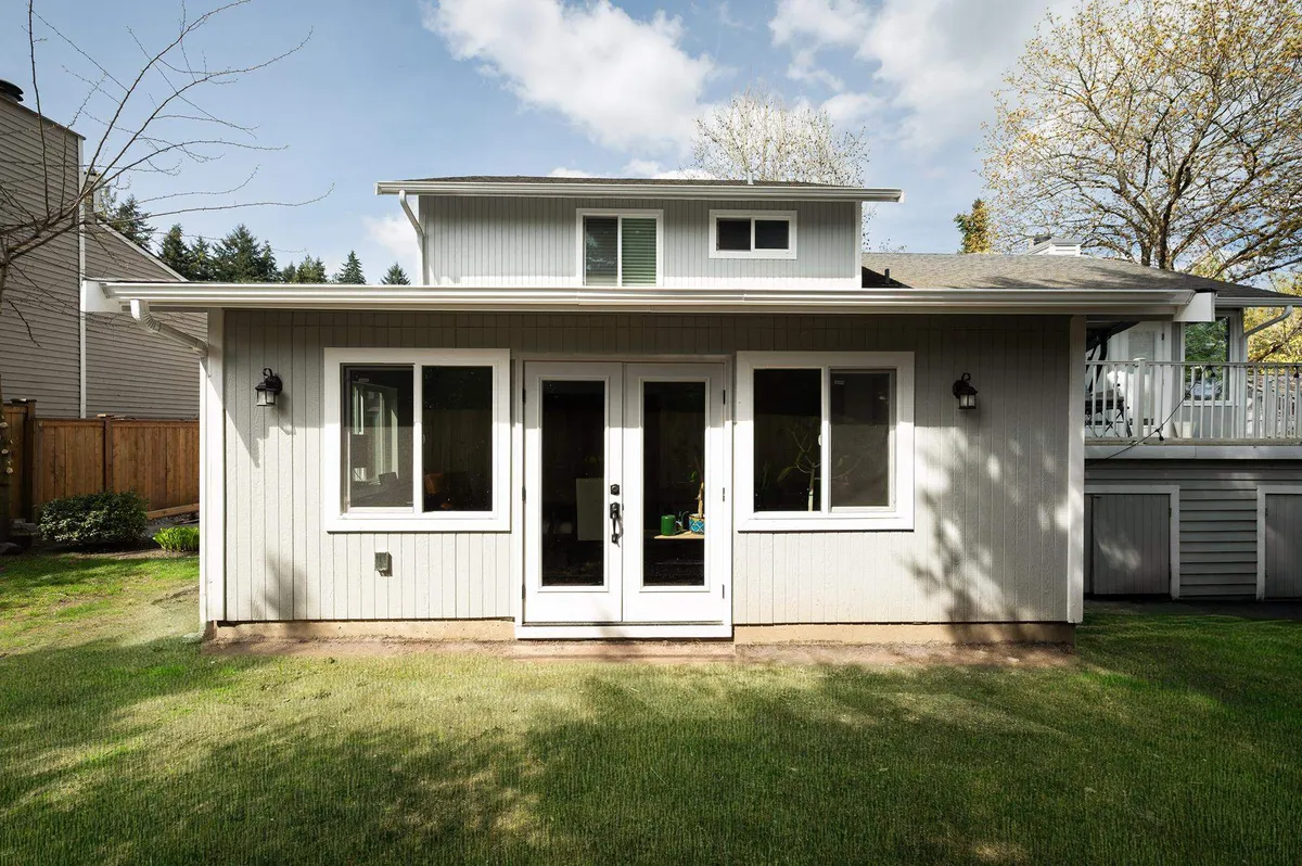 New addition with French doors opening onto a back lawn