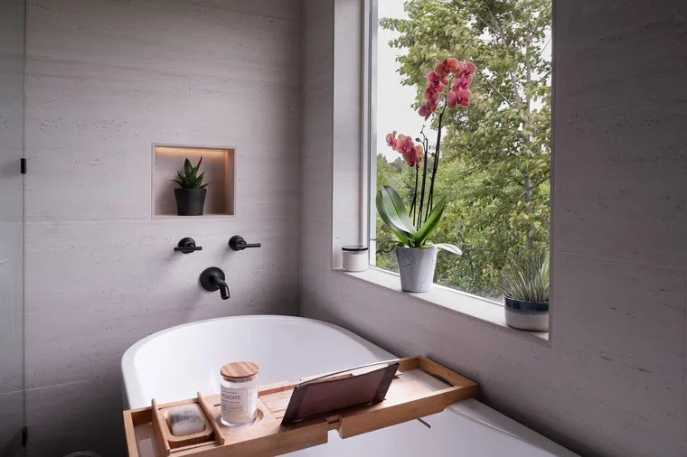Freestanding tub under a garden window